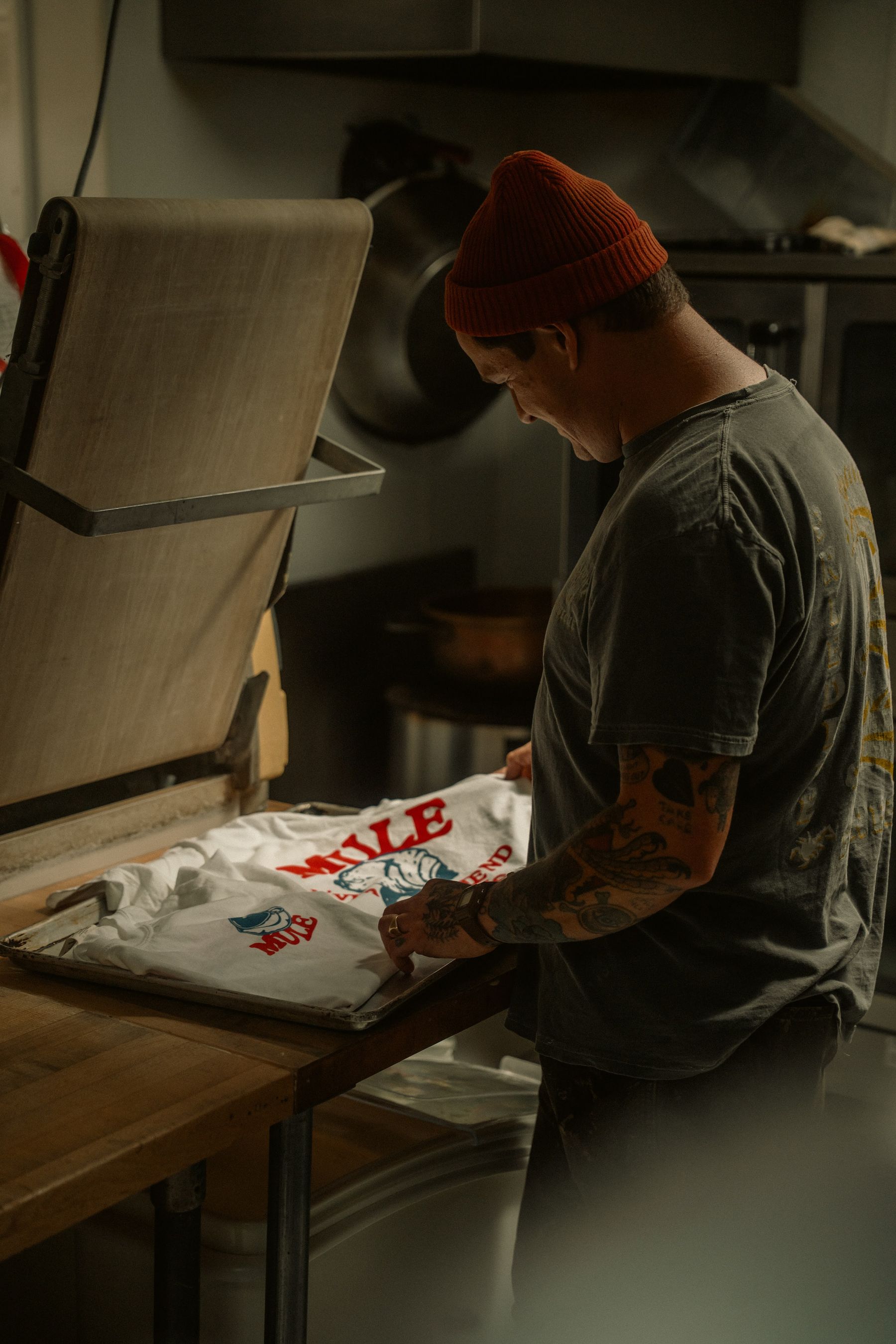 Screen printer working in a professional shop
